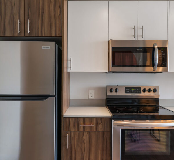 apartment kitchen with stainless steel appliances Pivot